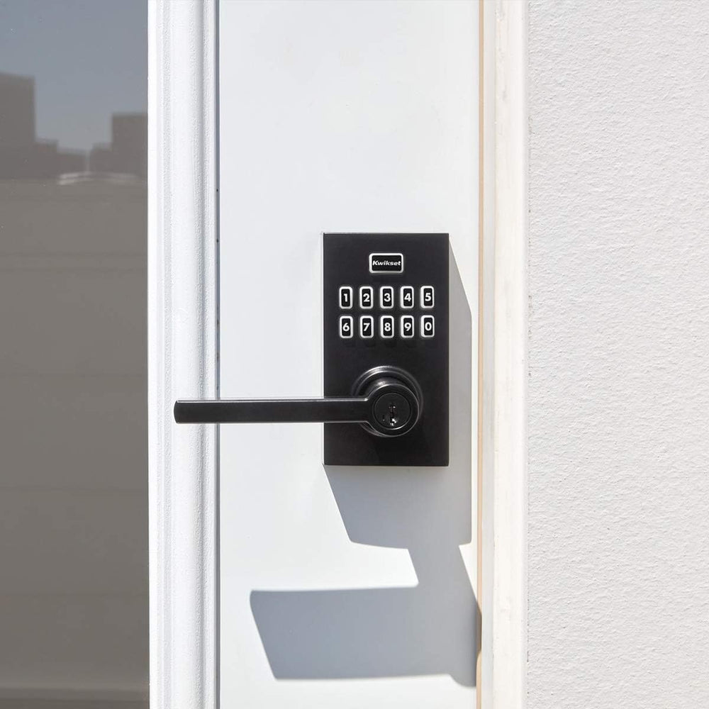 Kwikset battery compartment open with 9V battery included showing simple power setup