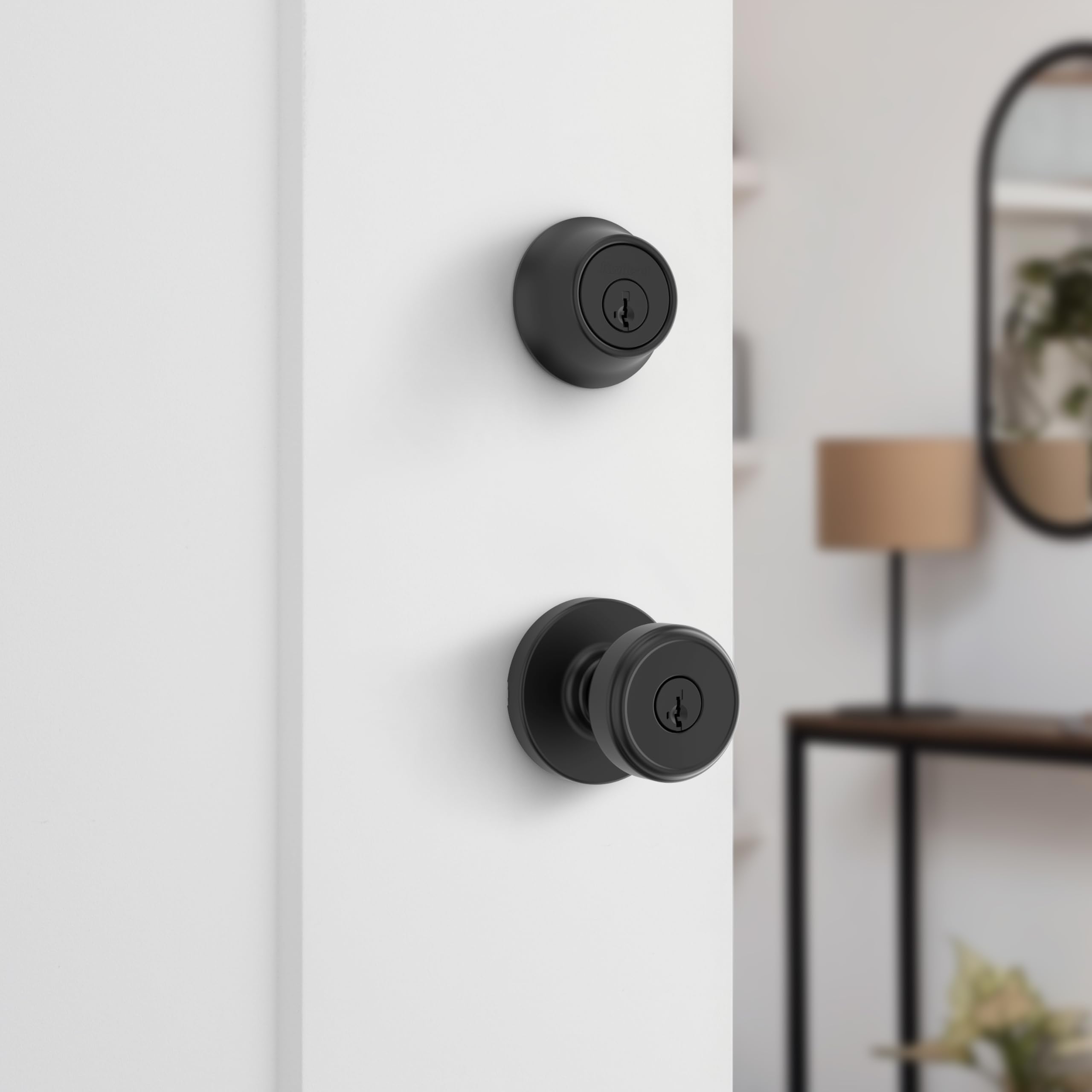 Kwikset Maven deadbolt close-up showing bolt detail and solid build benefit: reliable locking