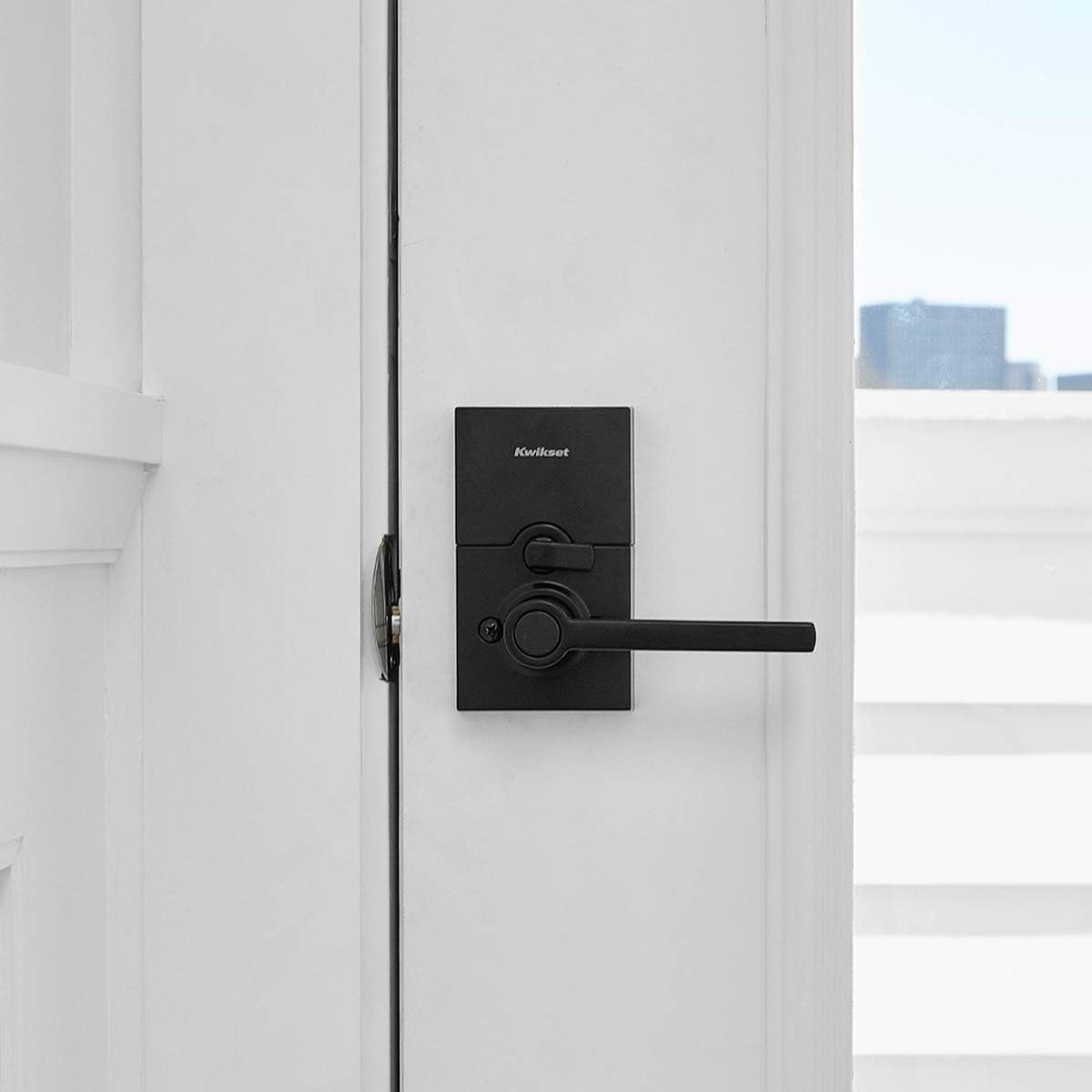 Kwikset SmartCode 917 next to a standard ruler showing scale and fit for typical doors