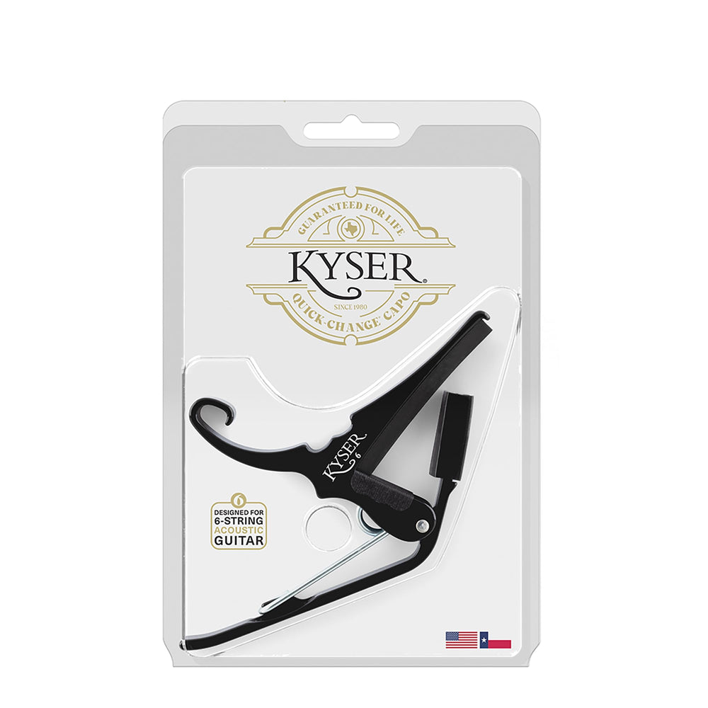 Kyser capo next to hand for scale clarity and ease-of-use benefit