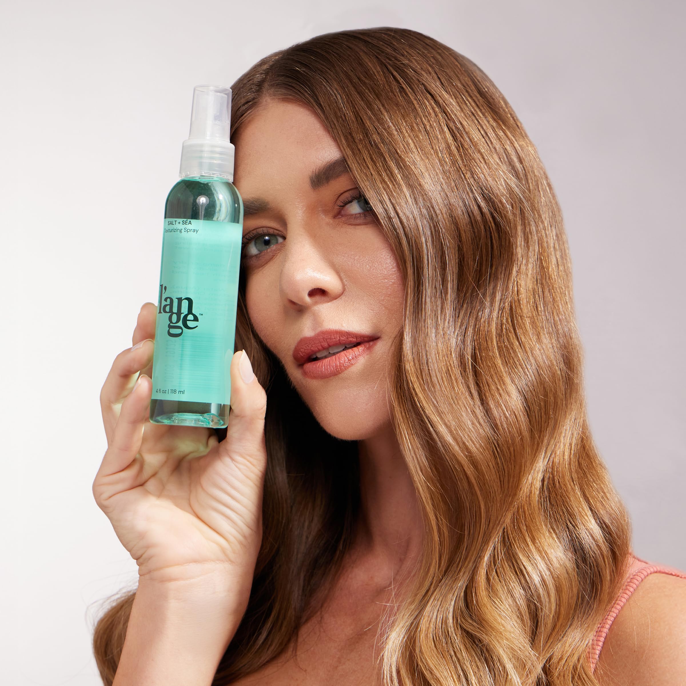 L'ANGE HAIR label close-up highlighting sea salt and kelp ingredients benefit