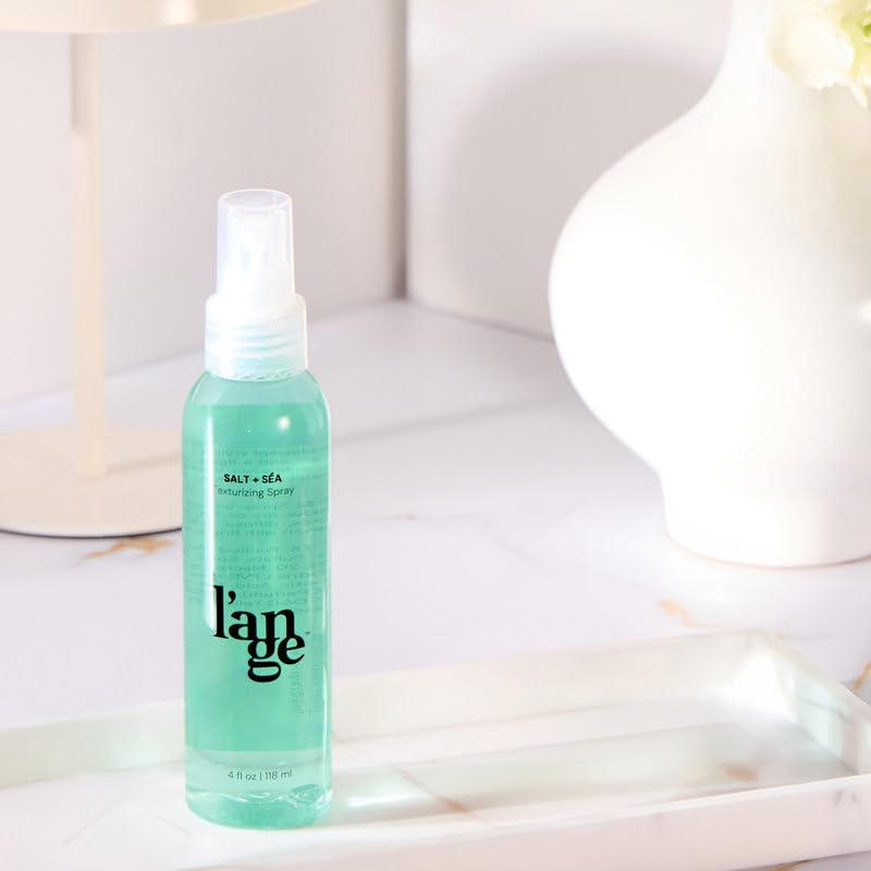 L'ANGE HAIR bottle inside a handbag illustrating portable styling solution
