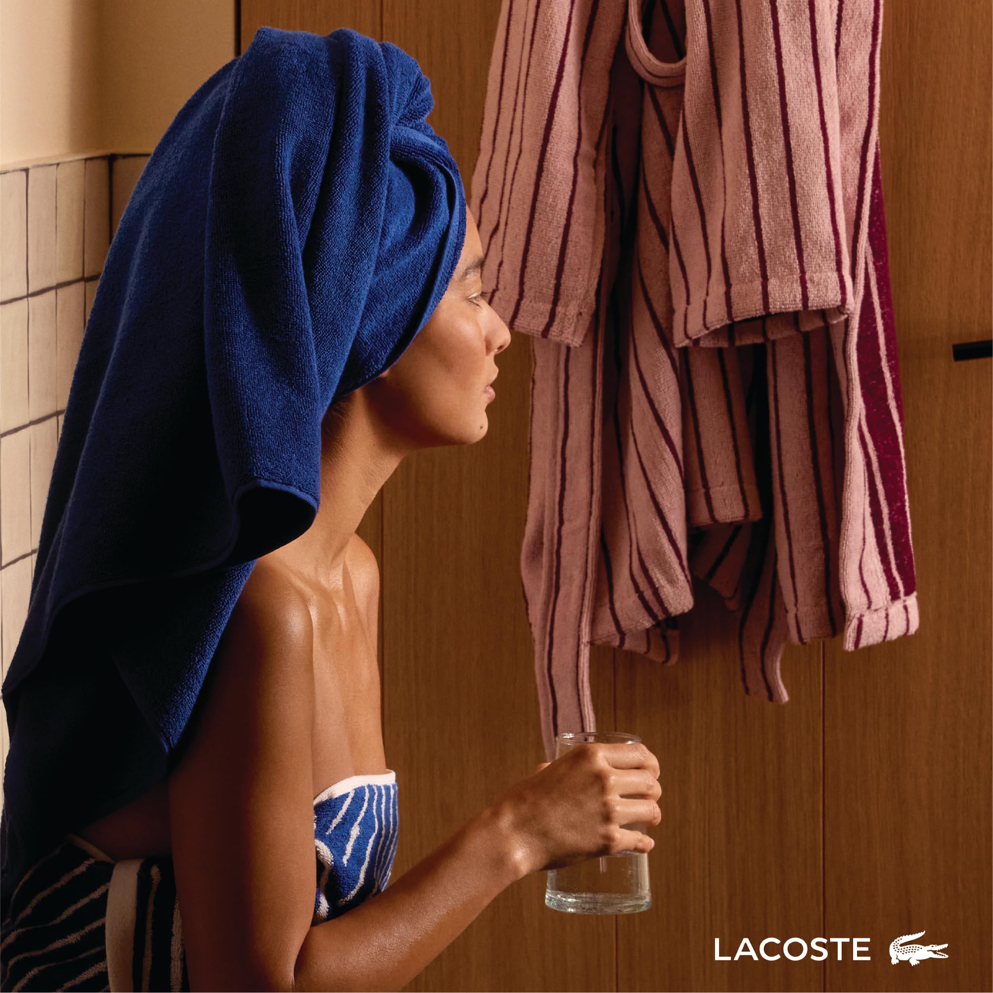 Lacoste towel draped on a towel bar demonstrating absorbent drape