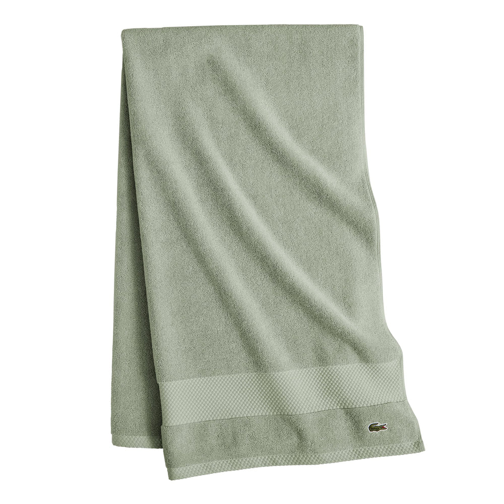 Lacoste embroidered crocodile logo visible as subtle designer accent