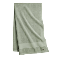Lacoste embroidered crocodile logo visible as subtle designer accent