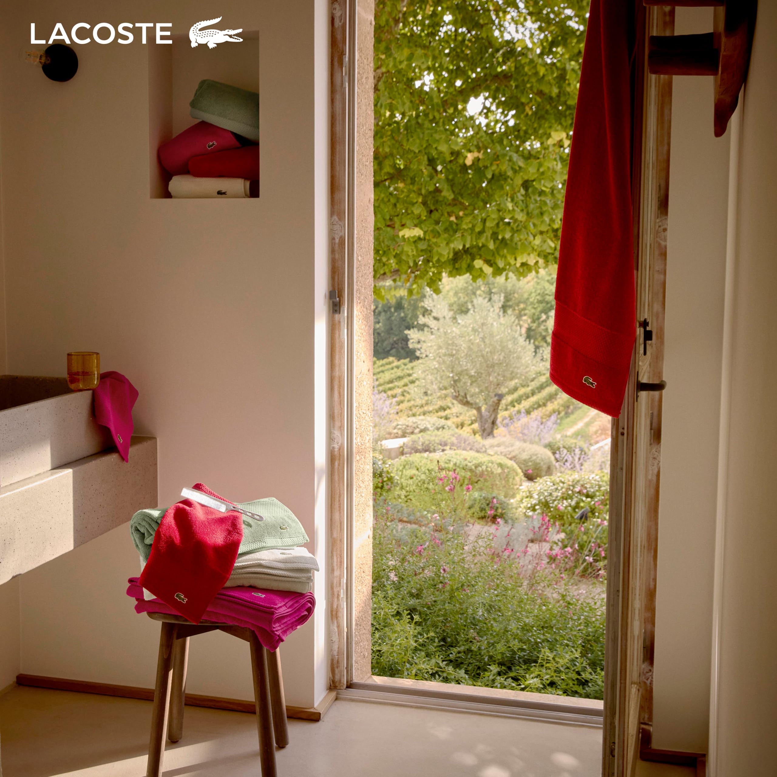Lacoste towel in a spa-style bathroom conveying calm, luxurious feel