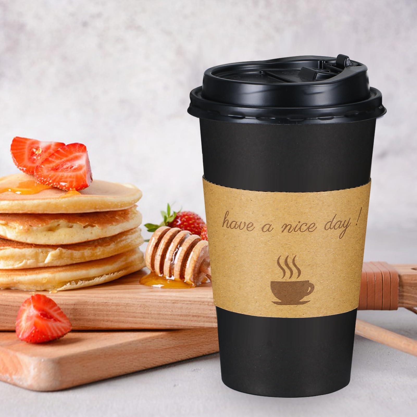 Lamosi 16 oz cup held in hand demonstrating secure grip and comfortable handling on the go