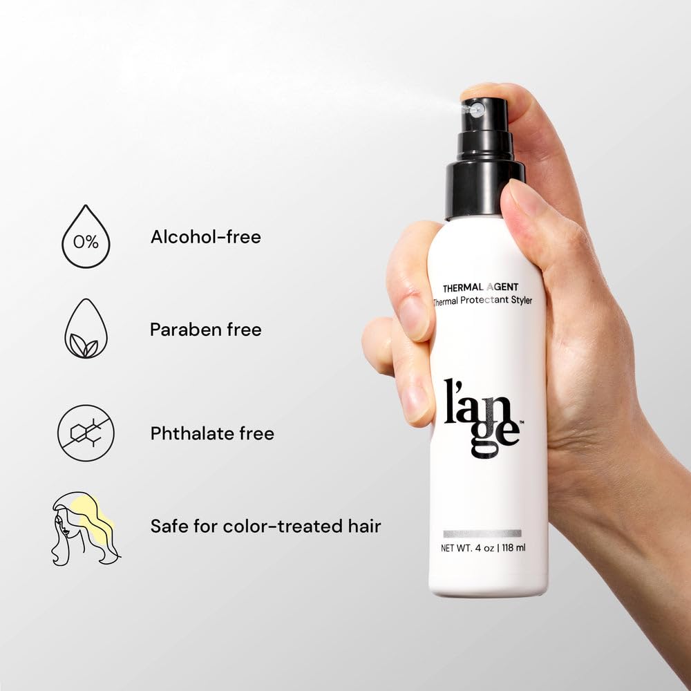 L'ANGE HAIR 4 fl oz bottle next to ruler showing travel-friendly size
