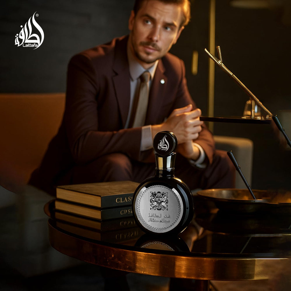 100 ml Lattafa Fakhar next to ruler for accurate size and travel consideration
