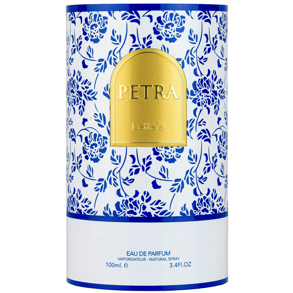 Lattafa Petra on a dressing table styled to evoke Mediterranean golden-hour warmth
