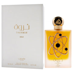 Lattafa Tharwah Gold fragrance splash in air conveying fresh sweet opening