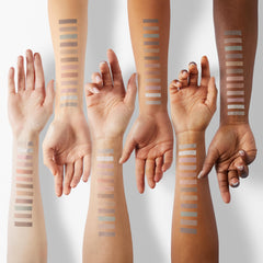 LAURA GELLER shimmer swatch on fingertip showing reflective payoff for inner-corner brightness