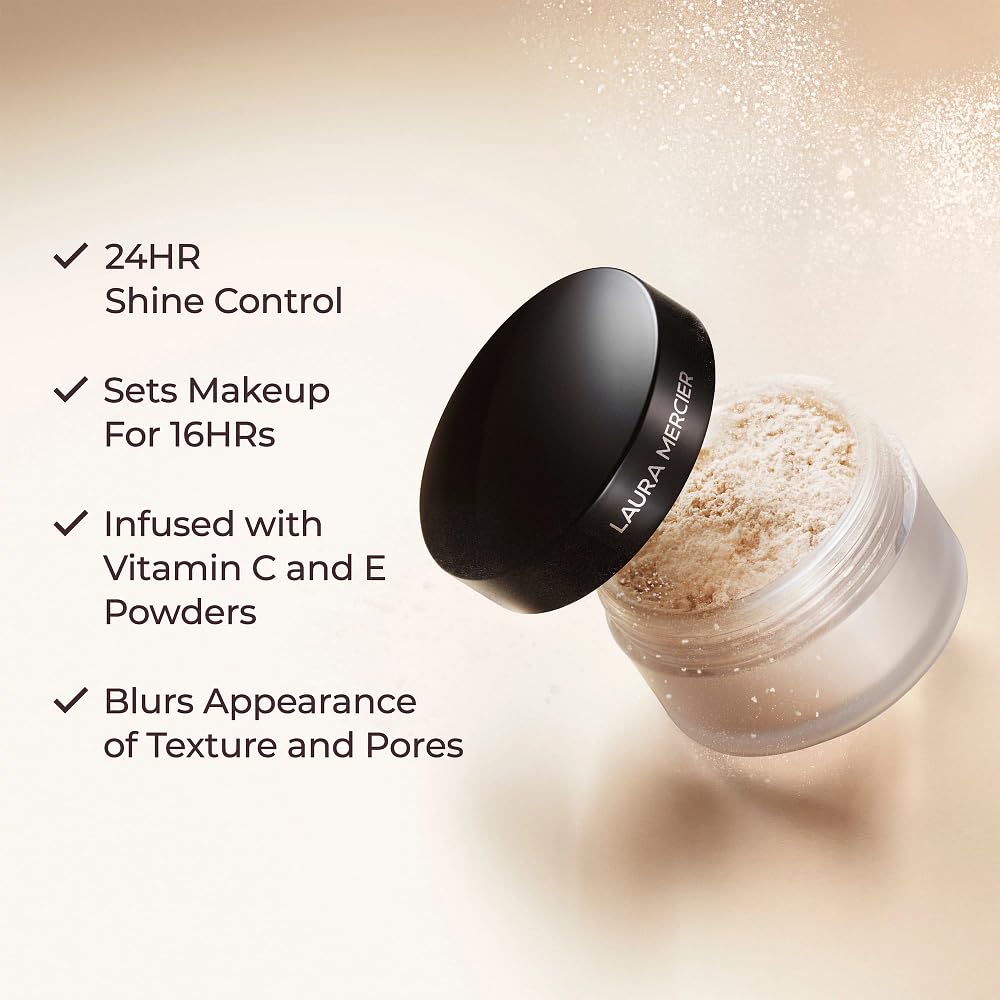 Laura Mercier brush applying powder on model to control shine and blur pores