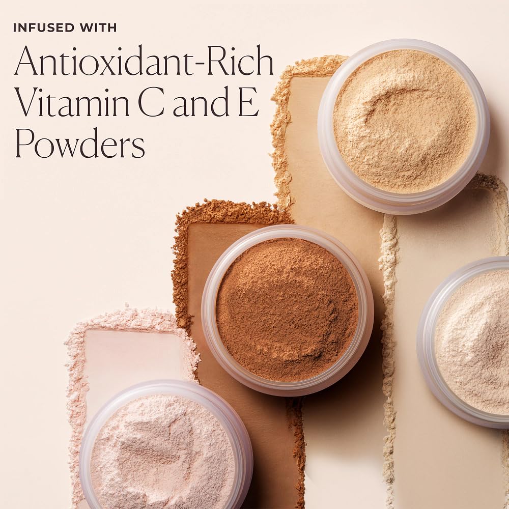 Laura Mercier powder next to foundation tube illustrating scale and compatibility