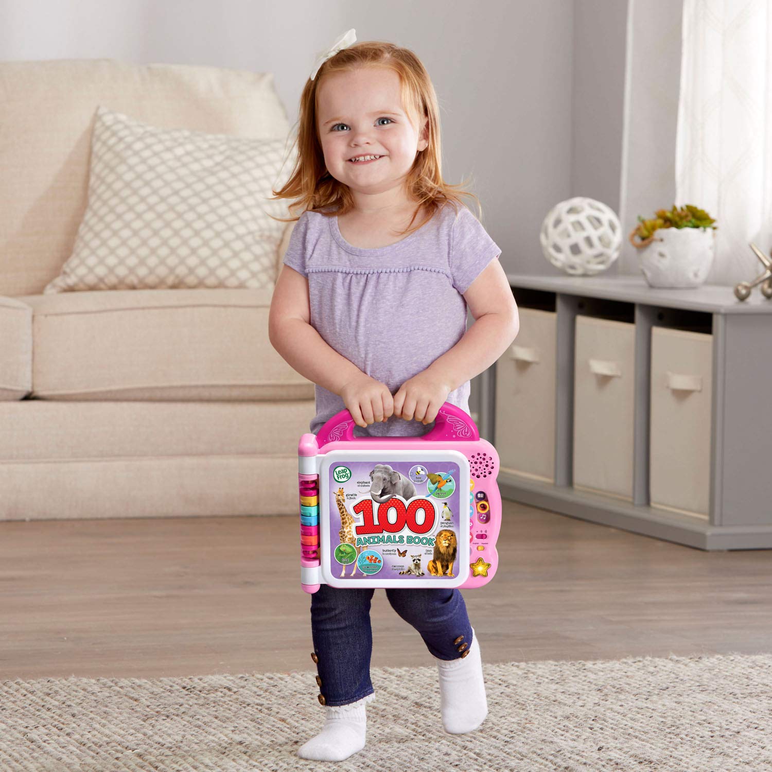 LeapFrog held in a child’s hand to show scale, demonstrates toddler-friendly size