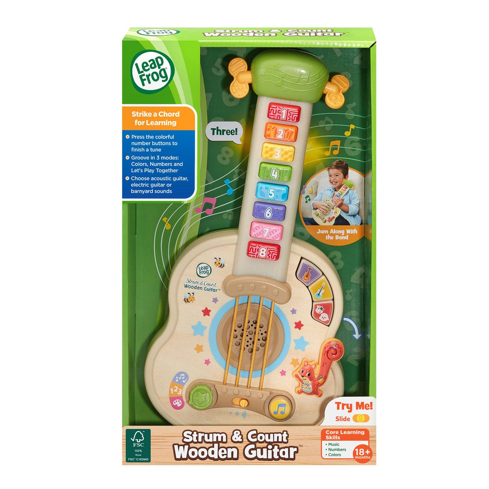 LeapFrog guitar beside toy blocks demonstrating toddler-sized scale