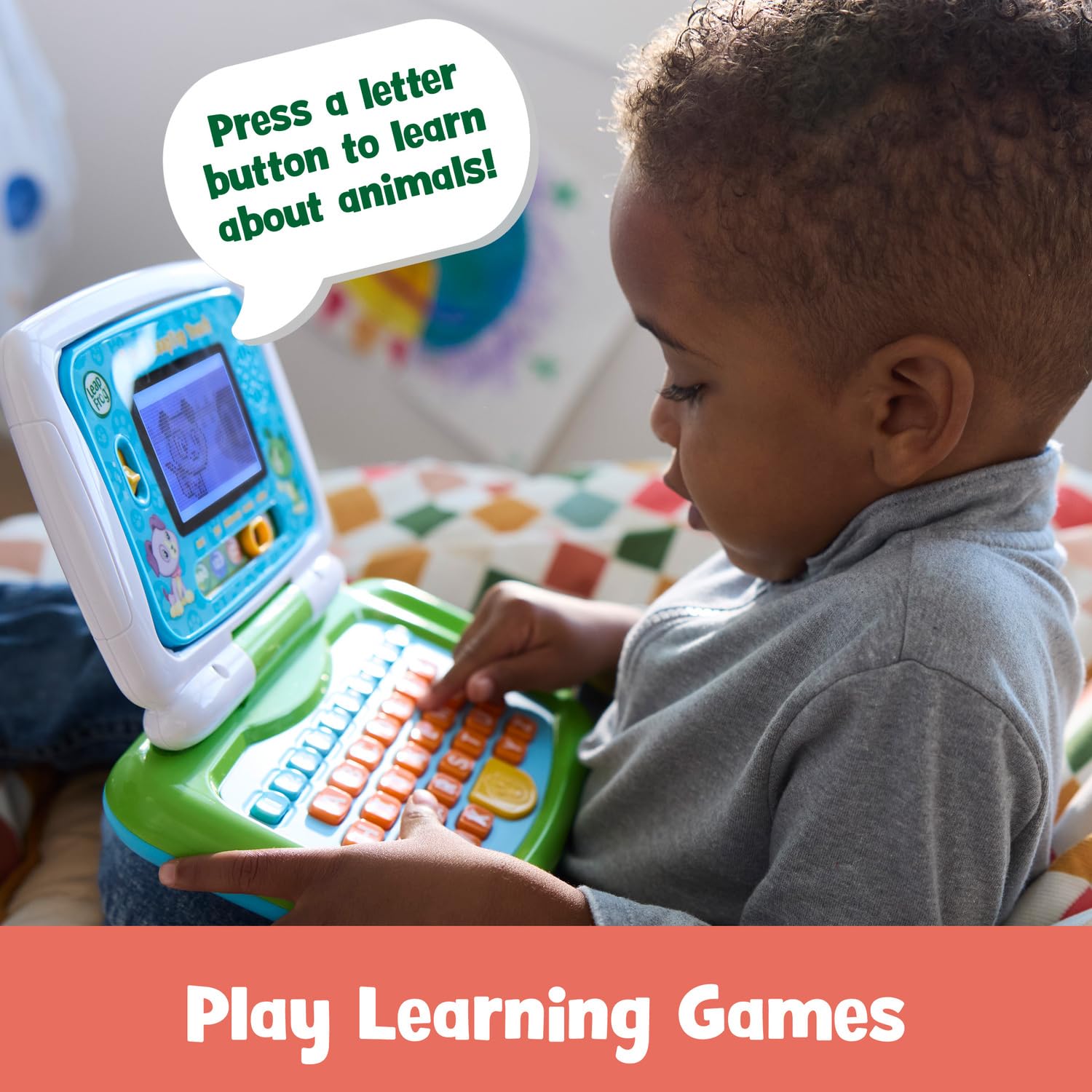 LeapFrog touchscreen interaction showing child tapping to build motor skills