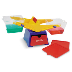 Learning Resources lids used as platforms with objects to extend balance experiments and creativity