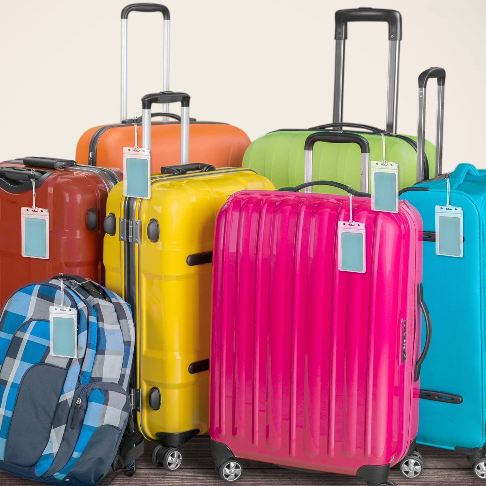 Lecpeting tags attached to a suitcase handle demonstrating secure travel organization