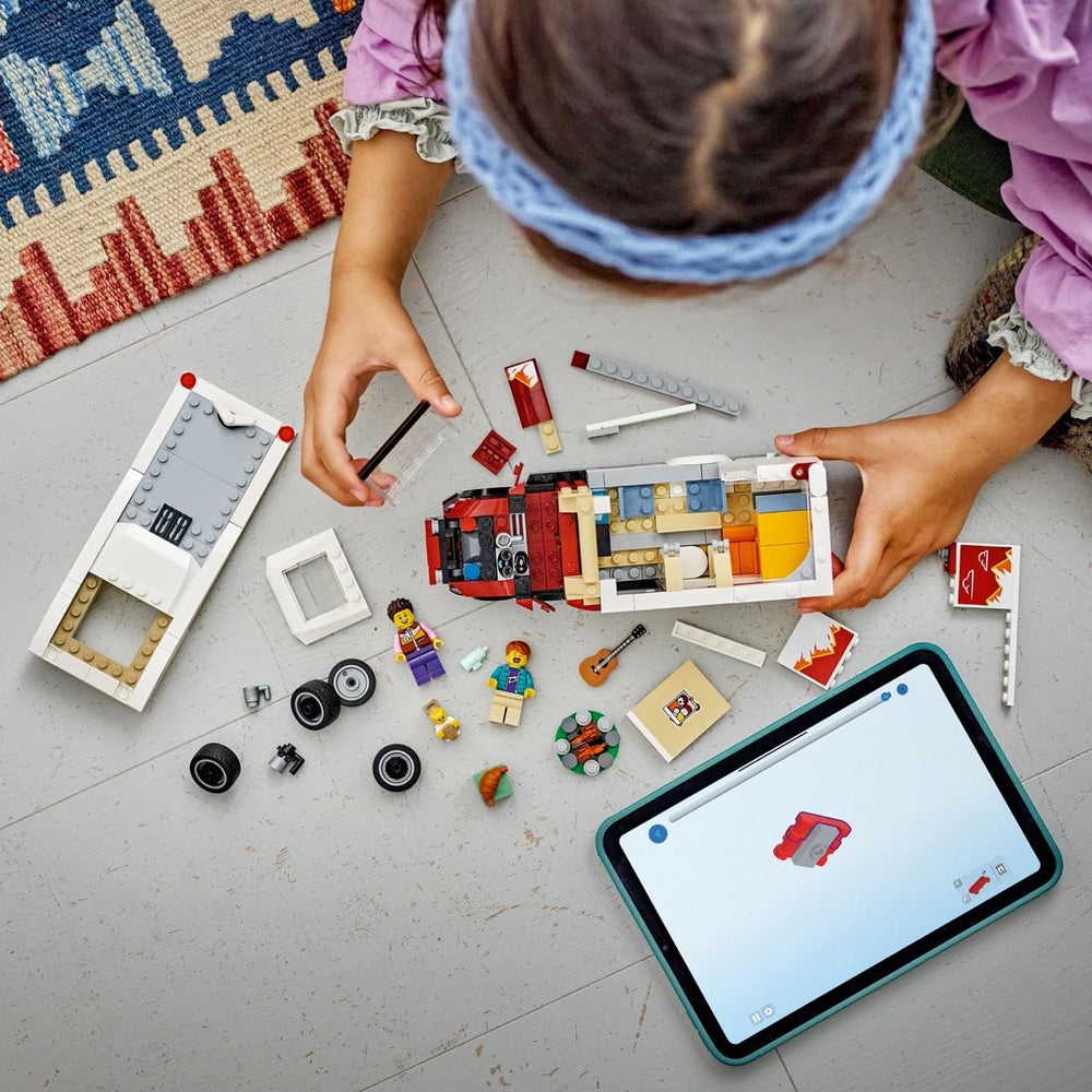 LEGO camper interior open to kitchen and seating, brand encourages imaginative play