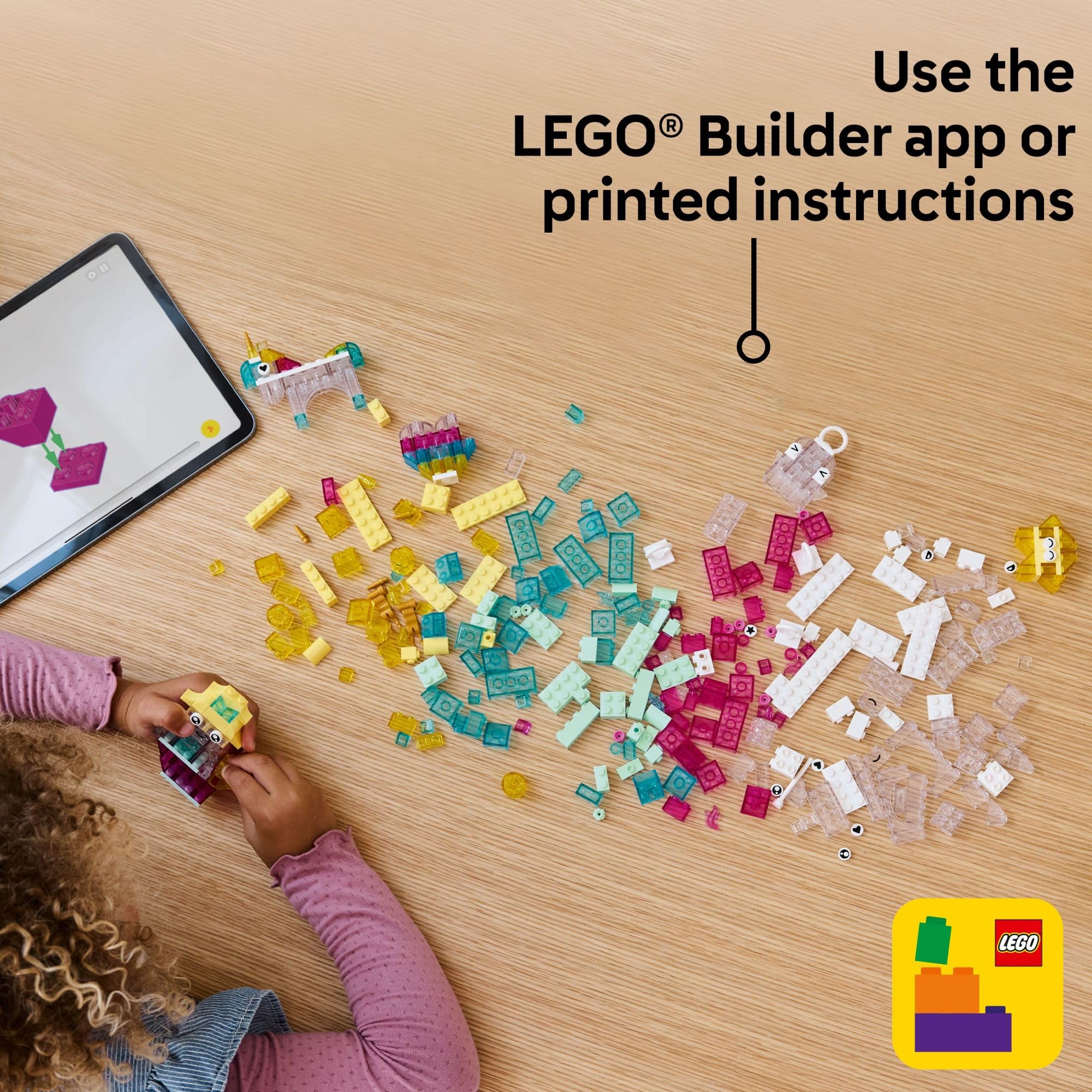Child's hand holding LEGO unicorn to show scale, LEGO fits small hands comfortably