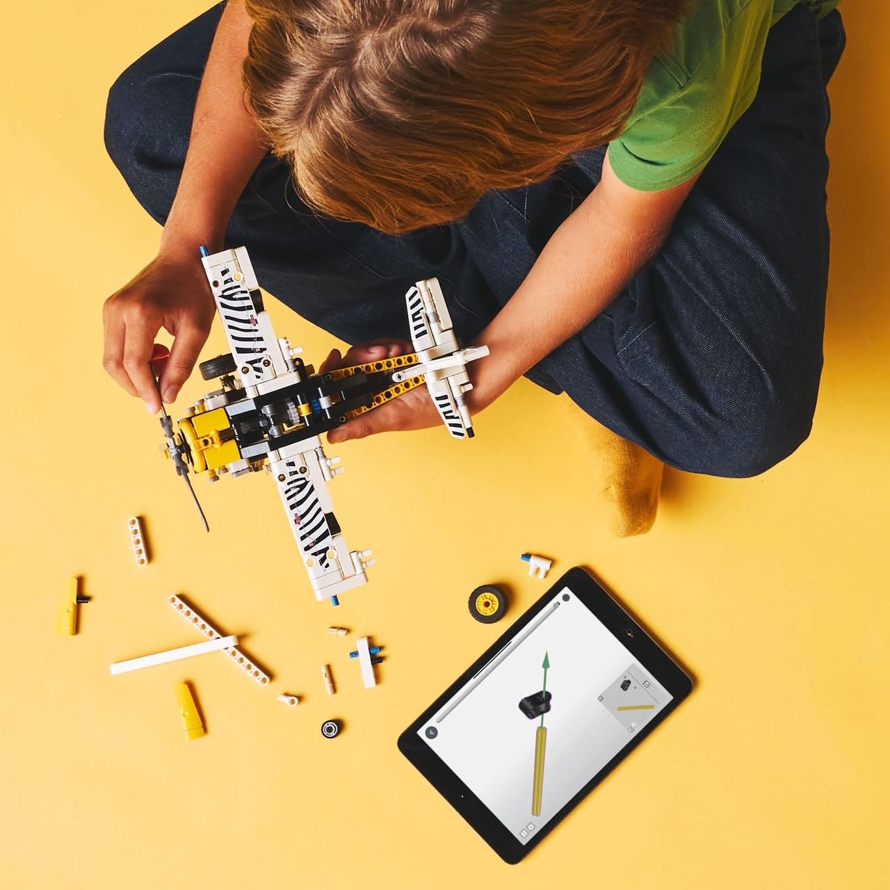 LEGO Technic bush plane engine detail with visible 4-cylinder pistons teaching mechanics