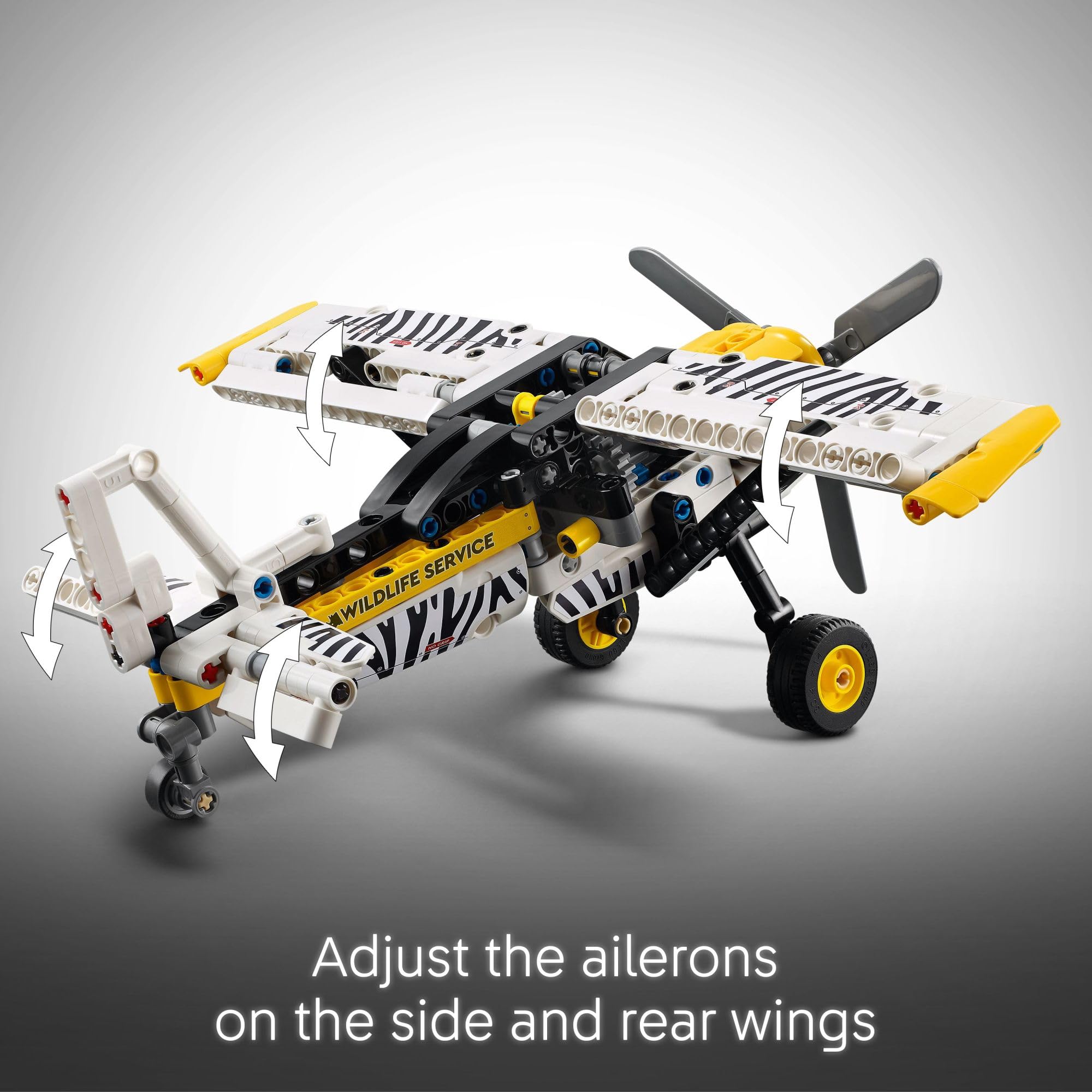 LEGO Technic bush plane scale with hand to show size and easy handling