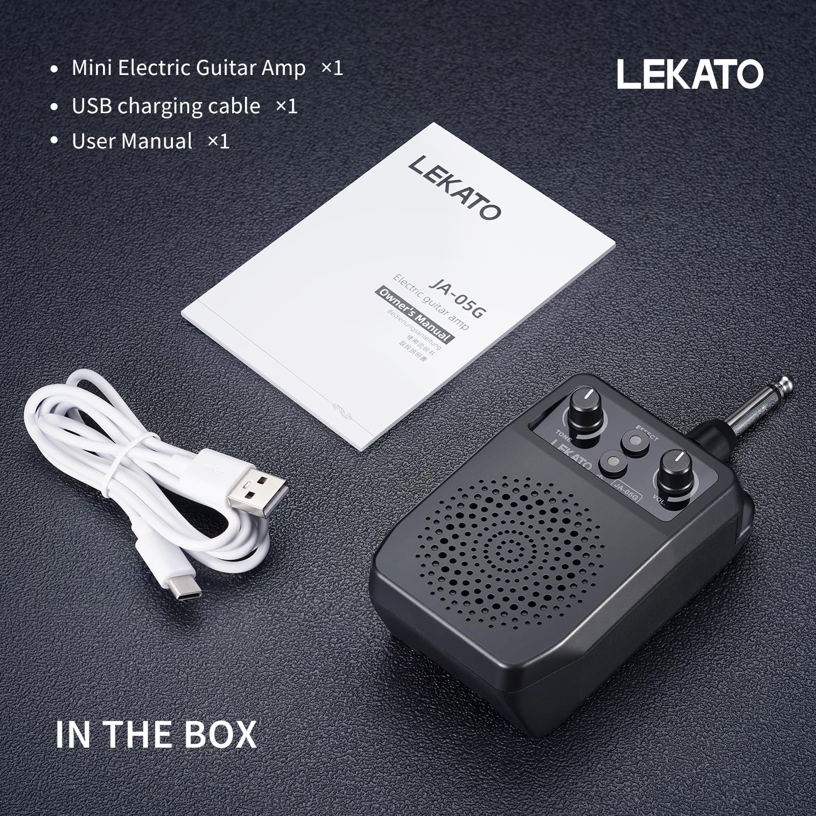 LEKATO mini amp next to smartphone for scale, demonstrates small portable size