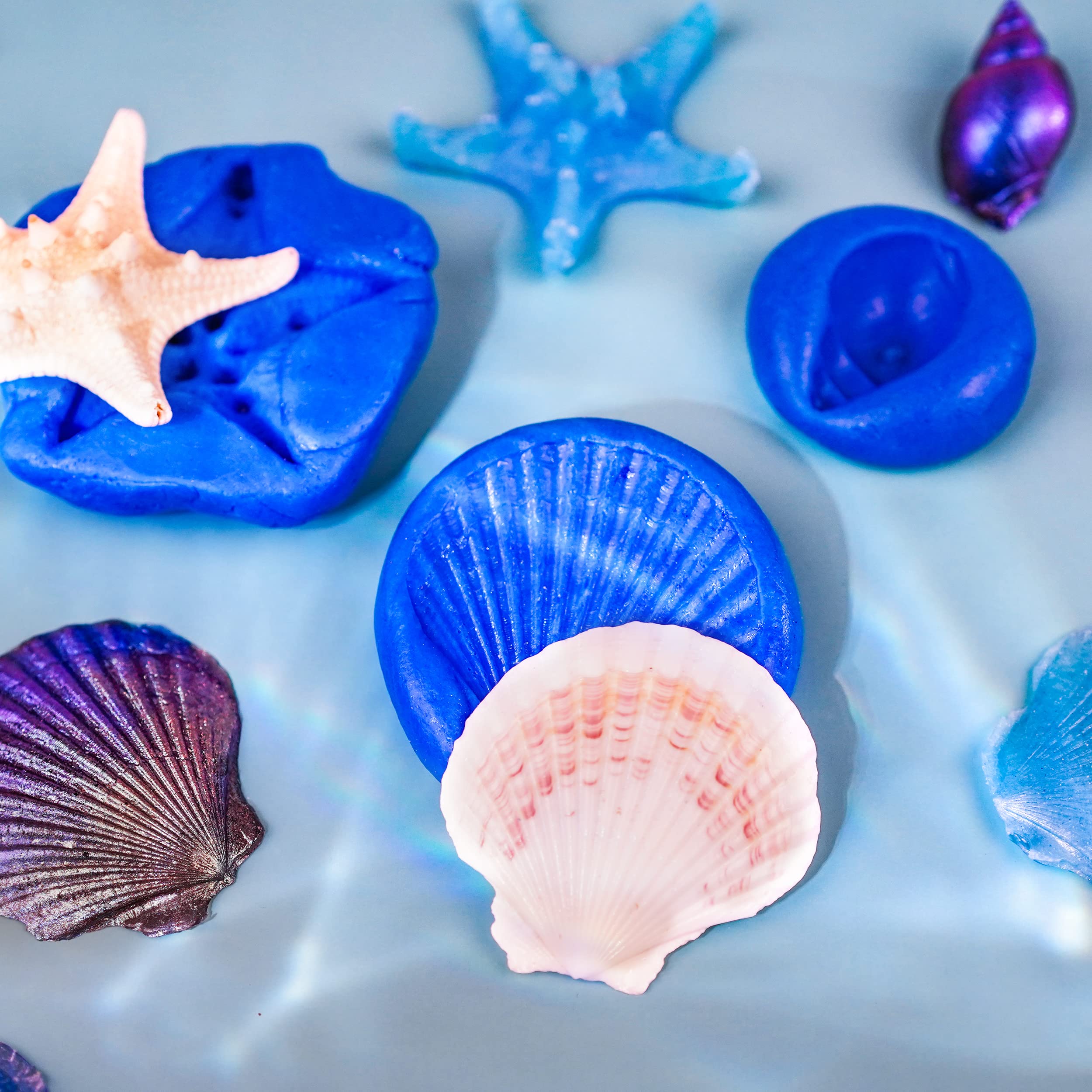 LET'S RESIN mold-making in use pressing putty around small object