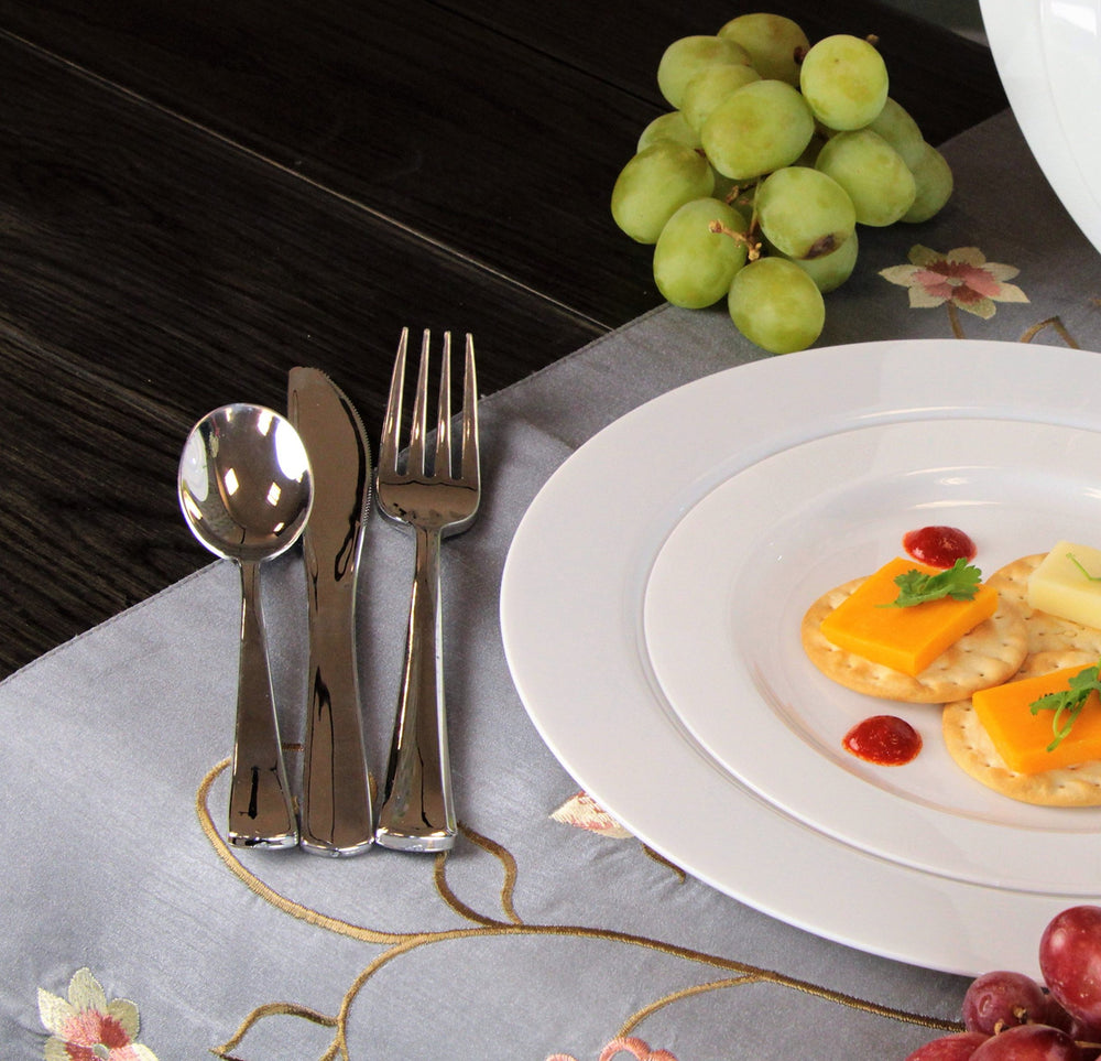 Lillian Tablesettings scale comparison next to metal silverware showing full-size fit