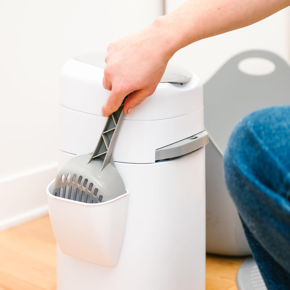 Litter Genie next to household item showing scale and compact footprint benefit