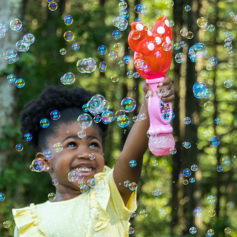 Little Kids Minnie Mouse wand in backyard setting encouraging outdoor fun
