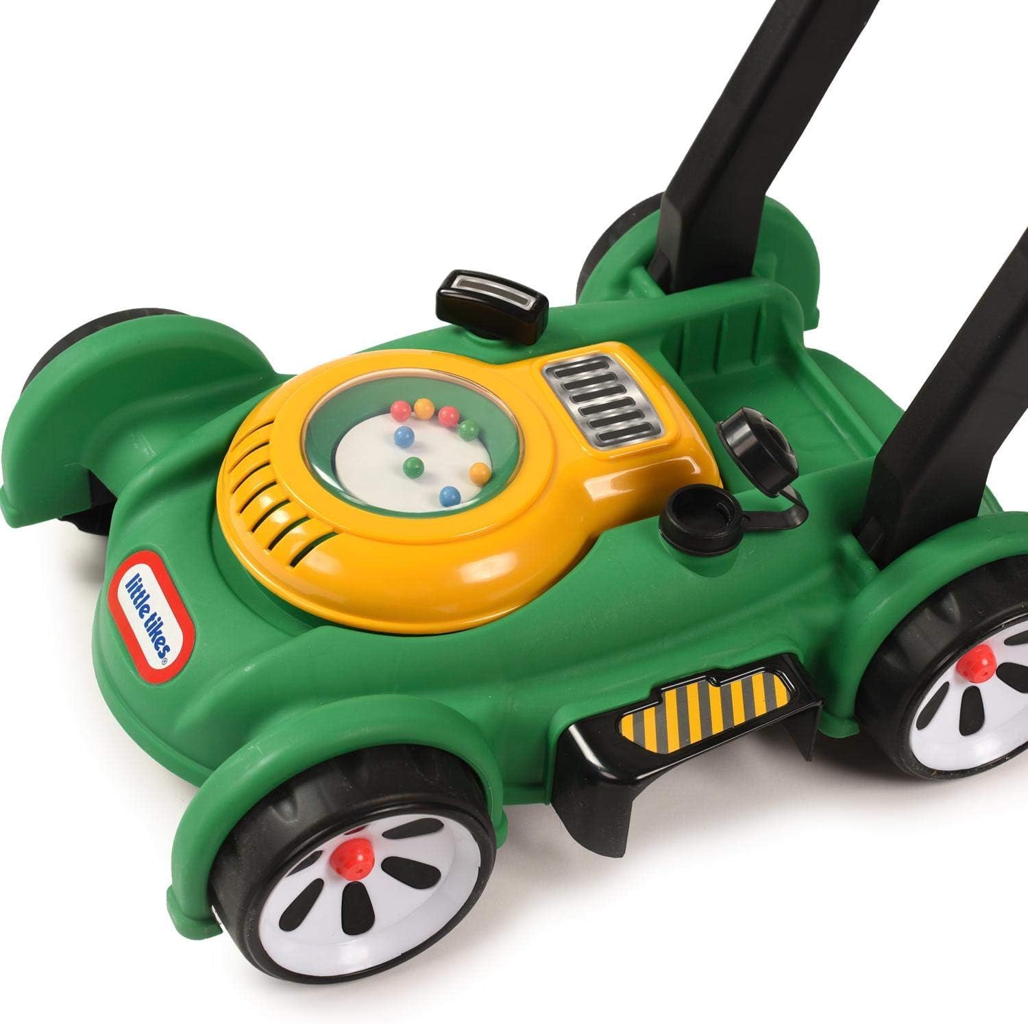 Little Tikes mower beside toddler for scale and encourages walking practice
