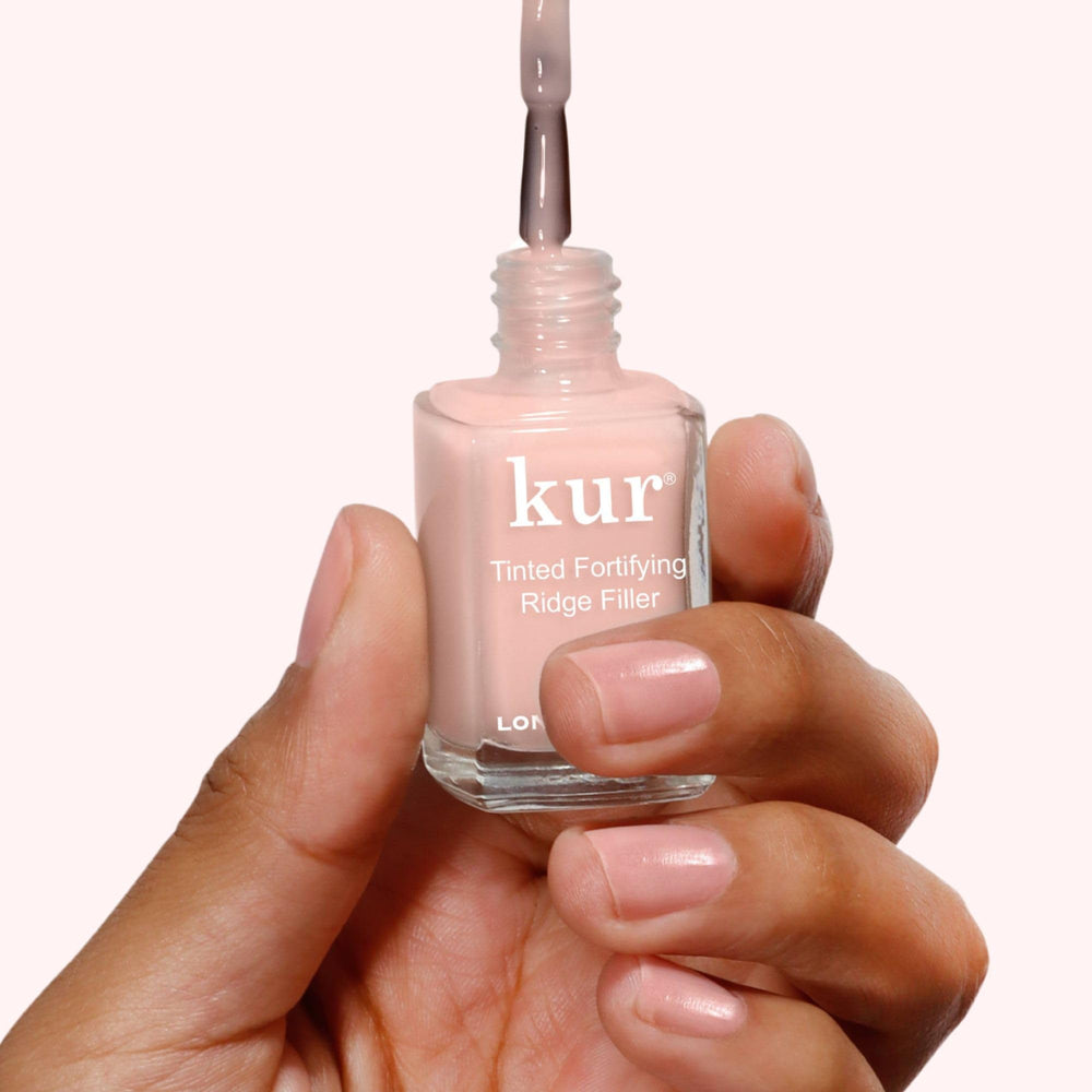 LONDONTOWN kur bottle label closeup highlighting ingredients and talc-free benefit