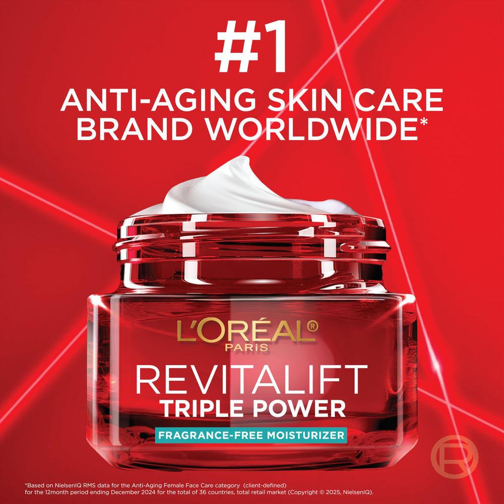 L'Oreal Paris model applying cream to cheek demonstrating easy absorption