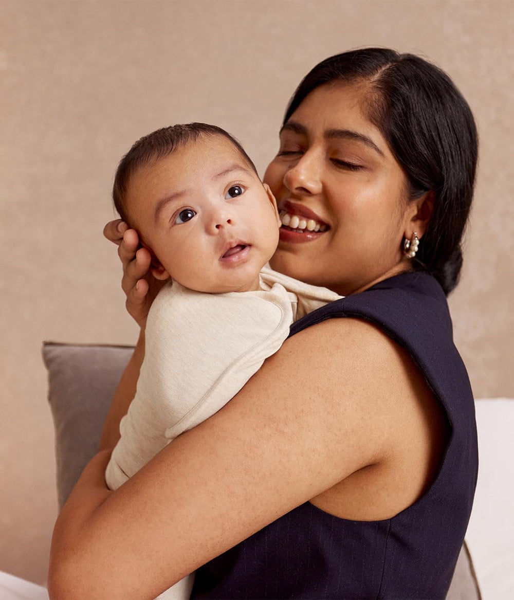 Love to Dream baby wearing swaddle arms-up demonstrating natural self-soothing position
