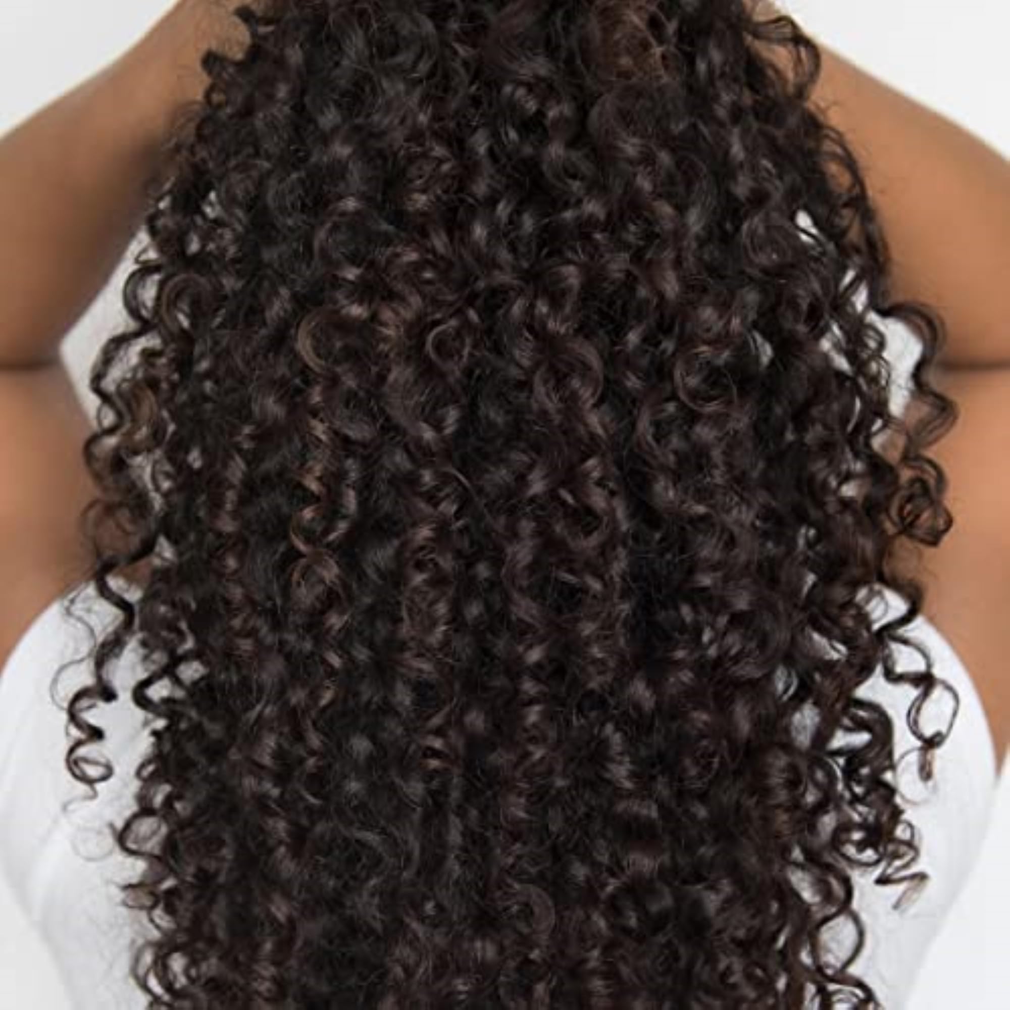 Love Ur Curls being applied to damp hair for even curl formation