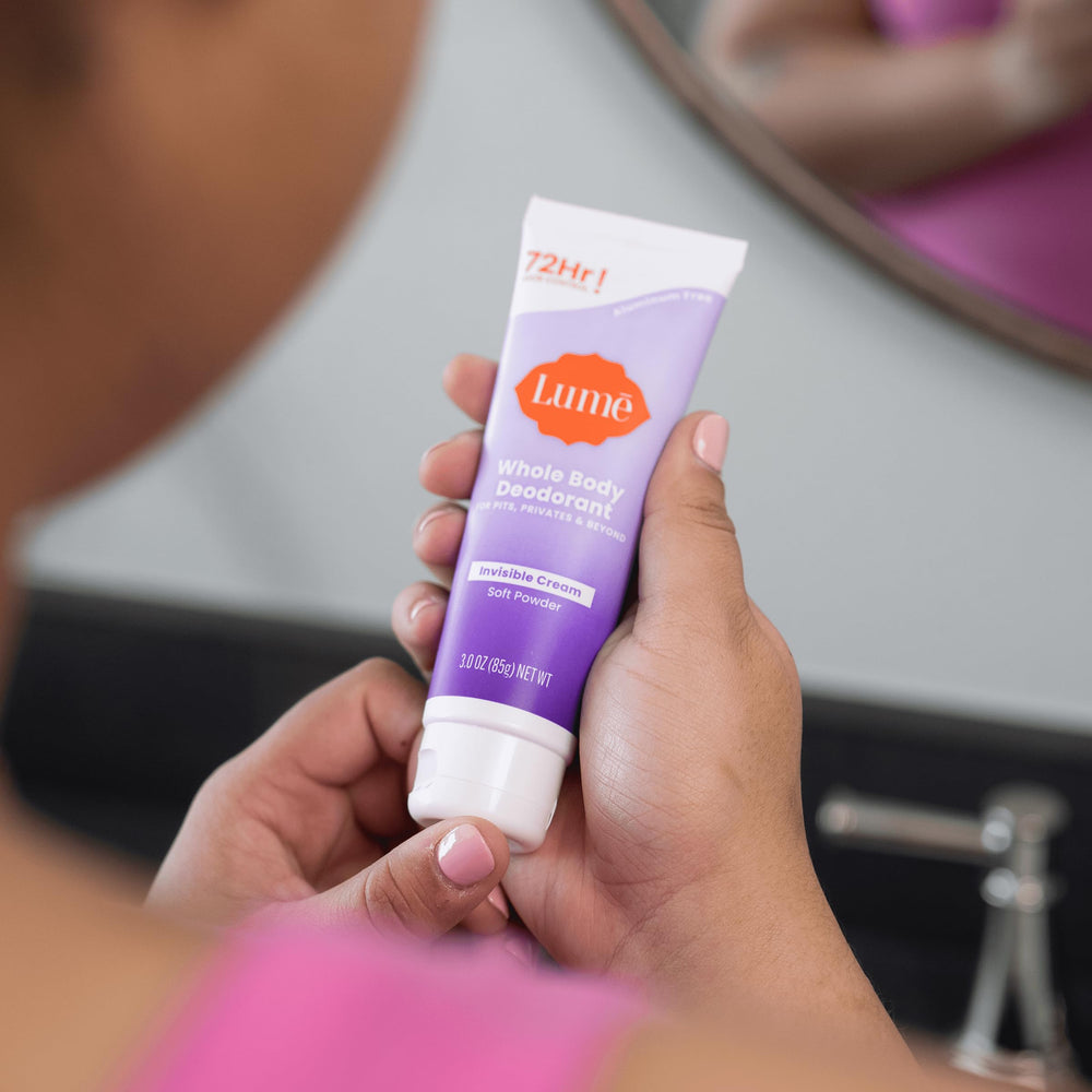 Applying Lume underarm to illustrate effective pit odor control and invisible finish
