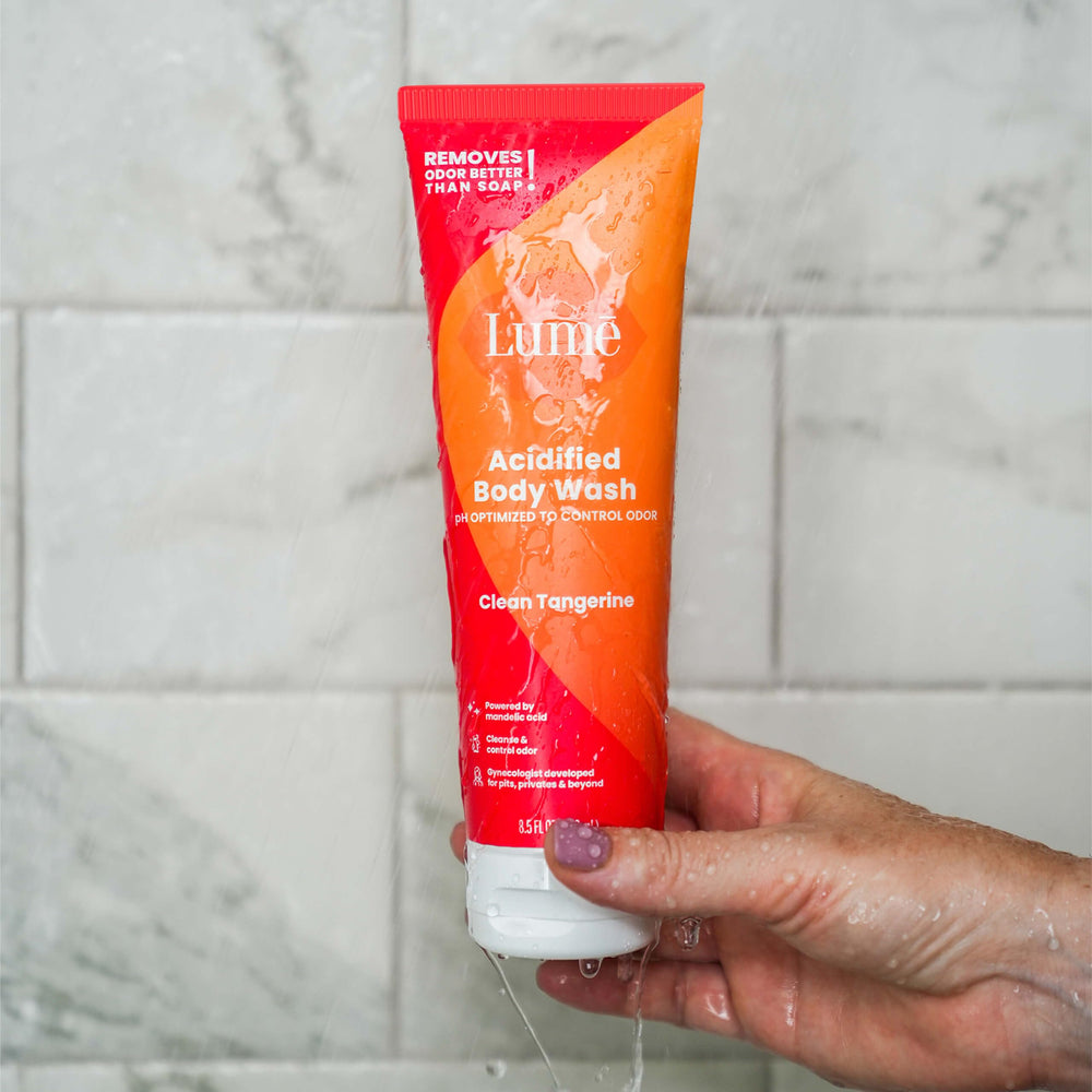 Lume bottle beside deodorant illustrating paired routine for extended freshness