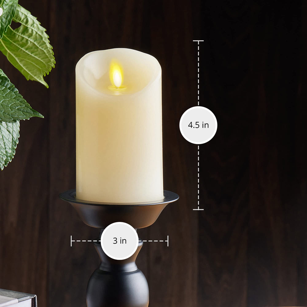 Luminara pillar inside a glass hurricane vase showing stable, decorative layering benefit