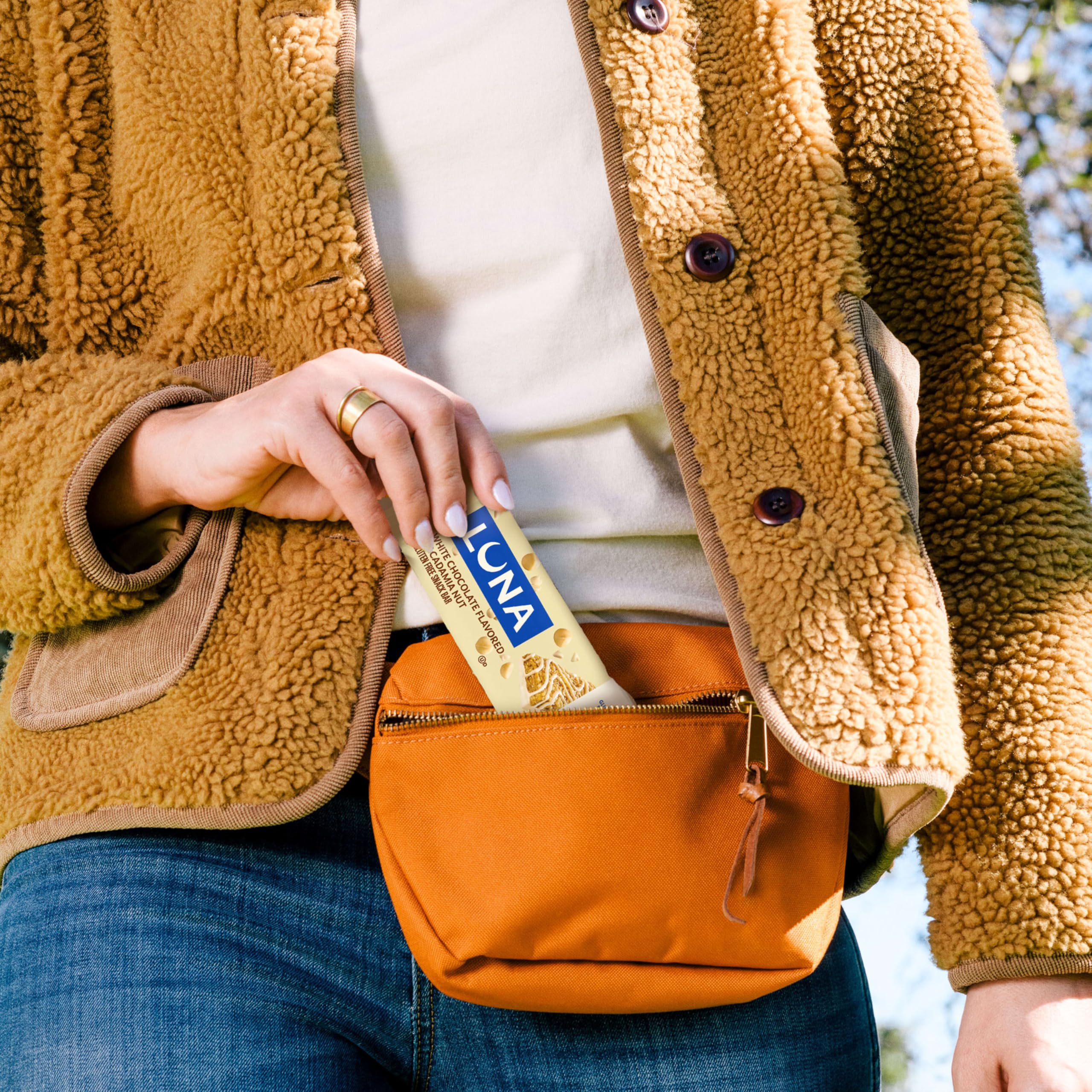 Luna Bar in a backpack pocket illustrating convenient snack for travel and commuting