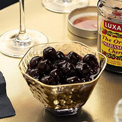 luxardo syrup pouring from can showcasing glossy syrup for cocktail sweetening