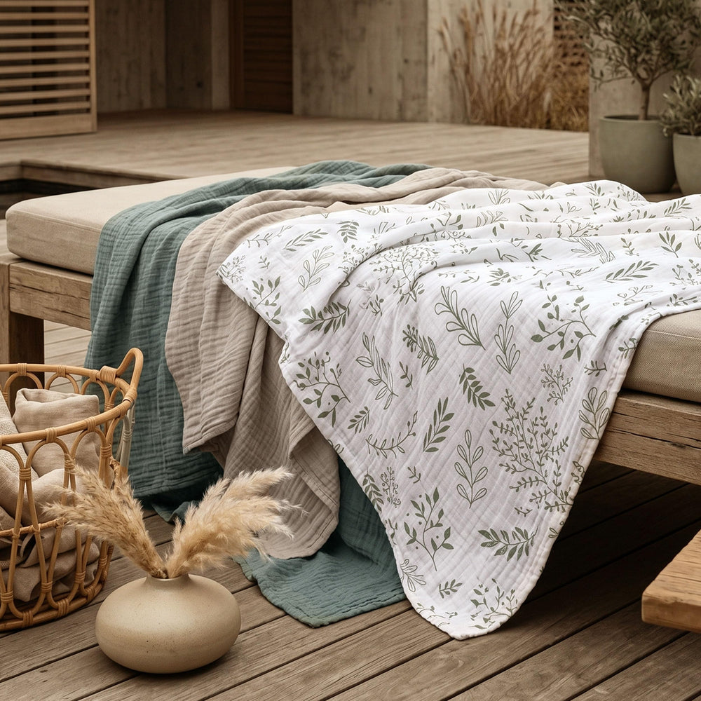 LYRICHOM BABY blanket beside an adult hand showing large 38x40 inch scale