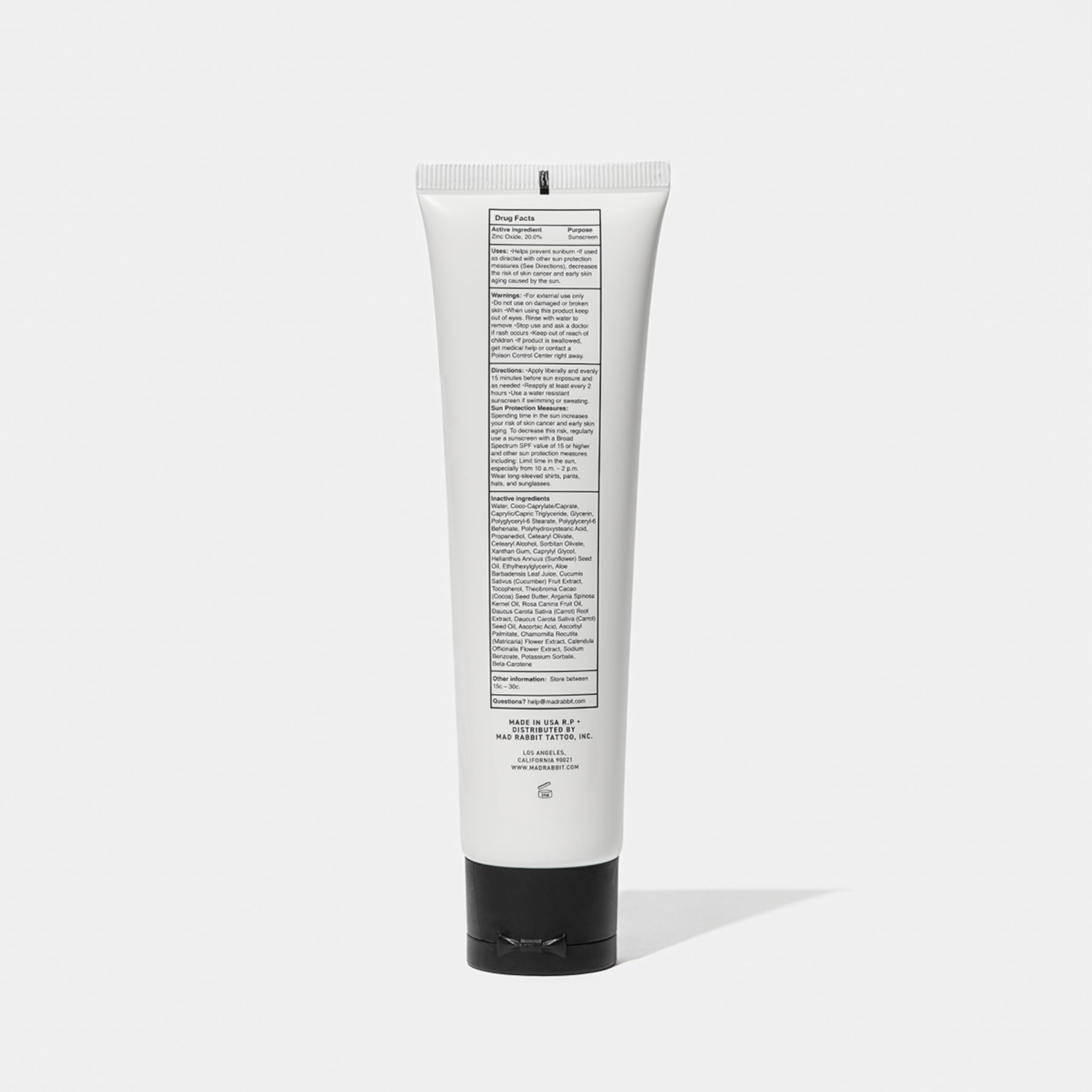 Mad Rabbit Defend flatlay with tube and natural extracts implying nourishing formula