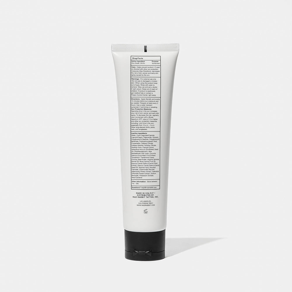 Mad Rabbit Defend flatlay with tube and natural extracts implying nourishing formula