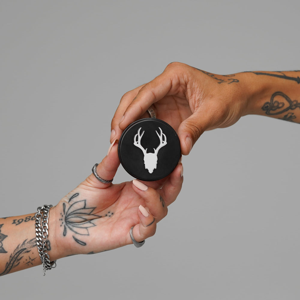 Mad Rabbit applied to forearm showing even coverage and moisturized tattoo benefit