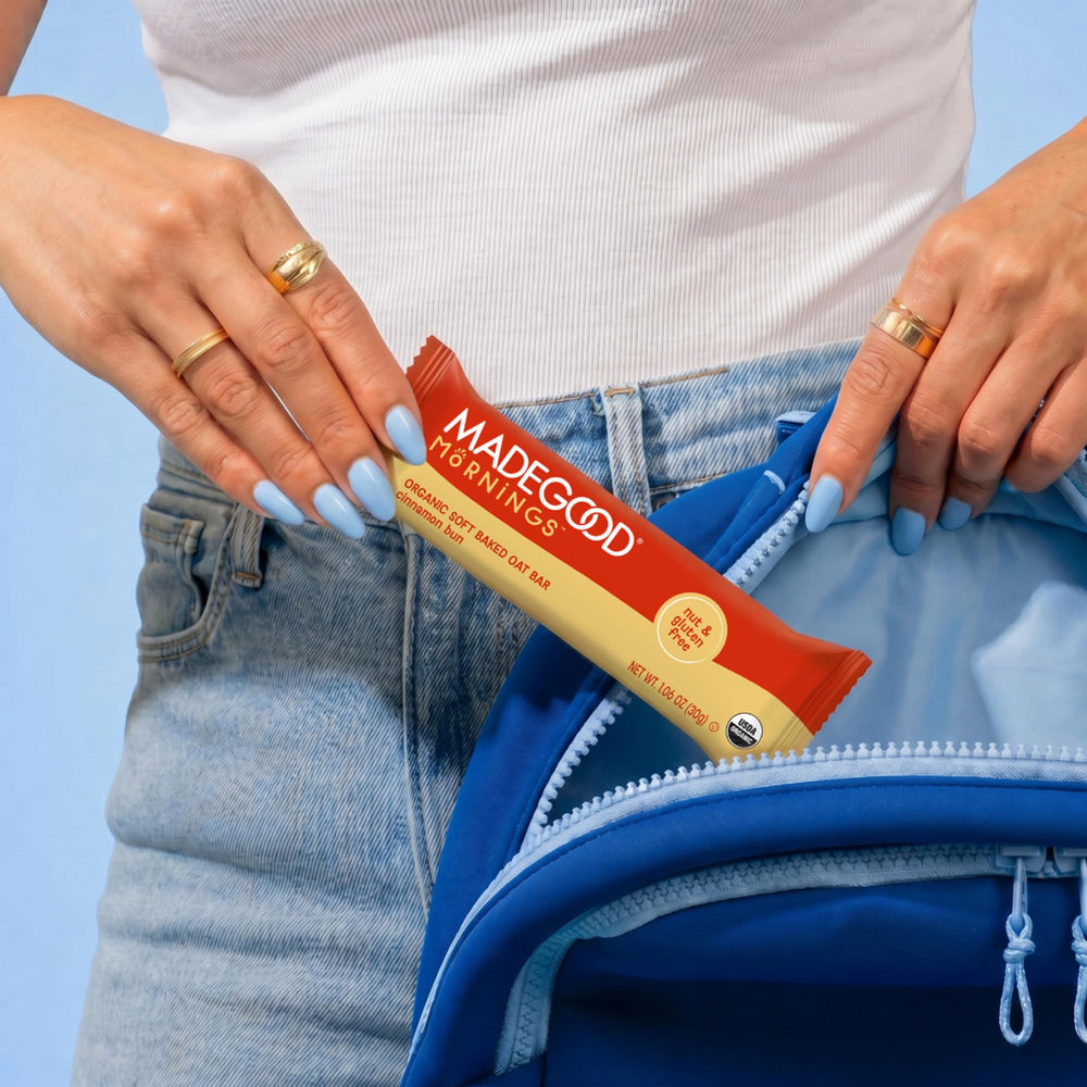 MadeGood bar held in hand showing 1.06 oz portion size convenience