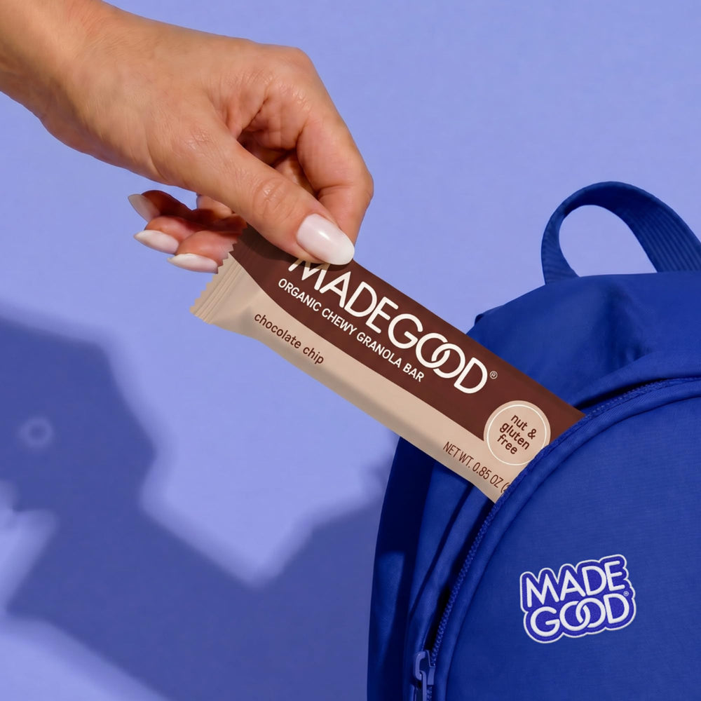 MadeGood bar next to an adult hand showing size and portion clarity