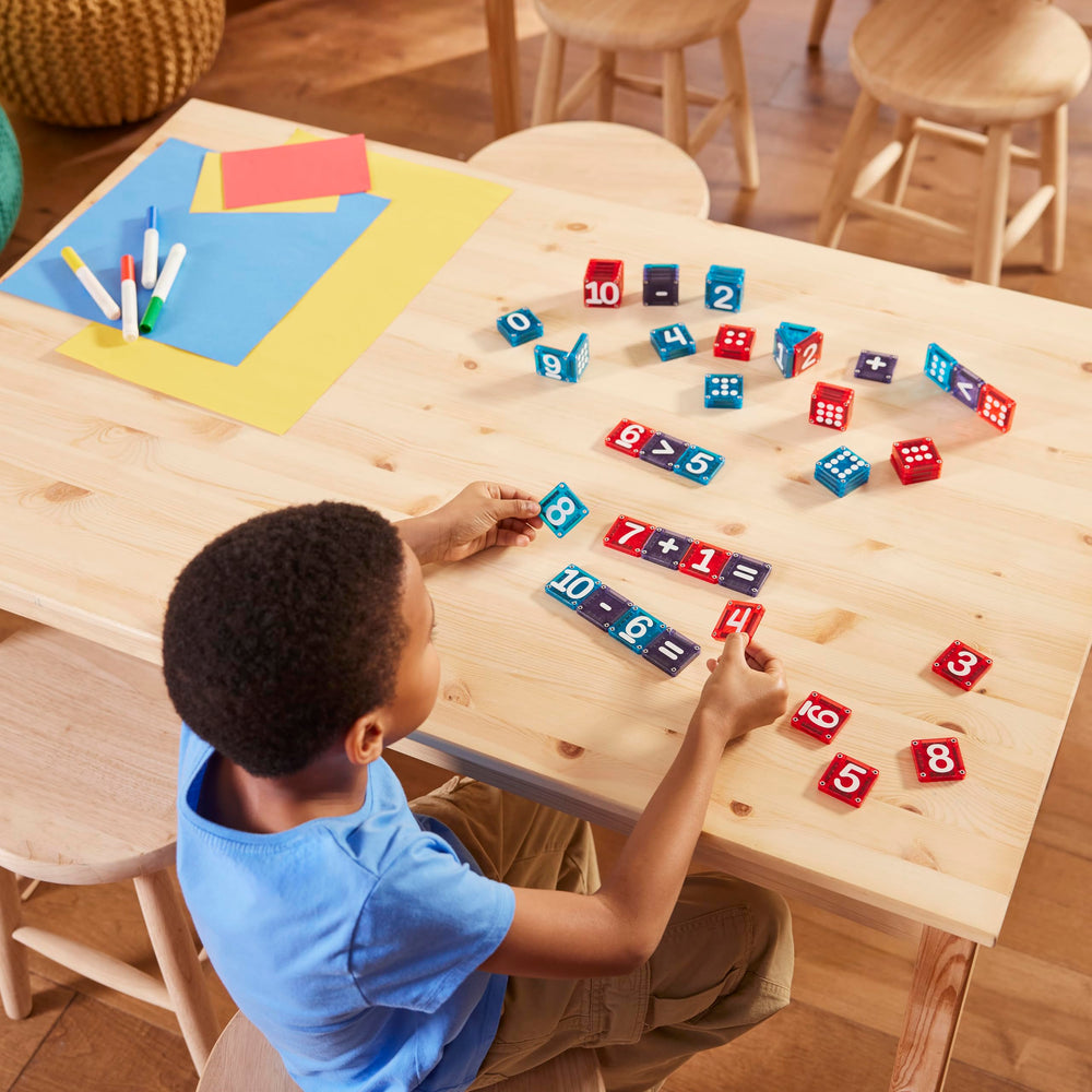 MAGNA-TILES classroom station with children using microMAGS to practice counting
