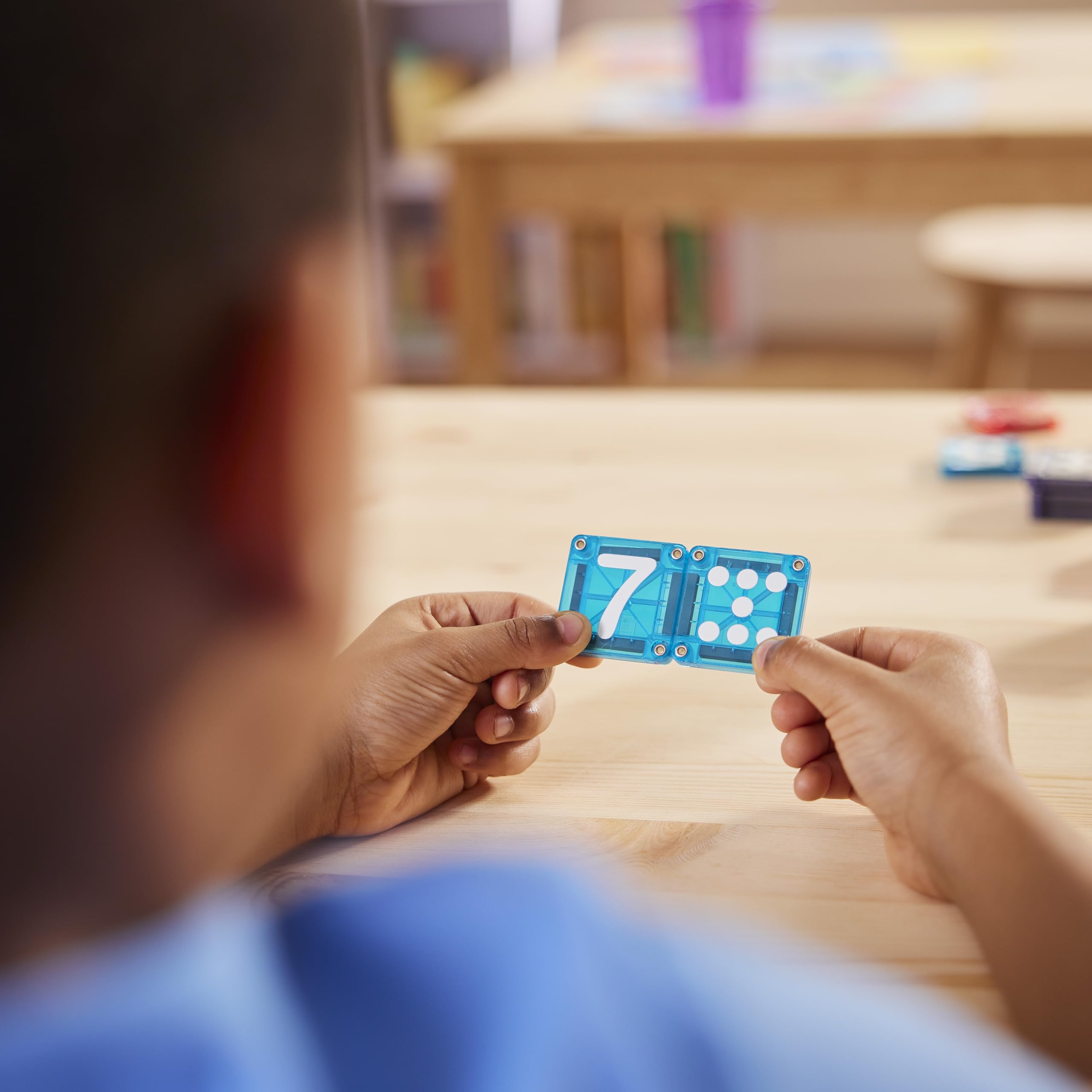 MAGNA-TILES microMAGS attached to larger tiles to extend learning and creativity